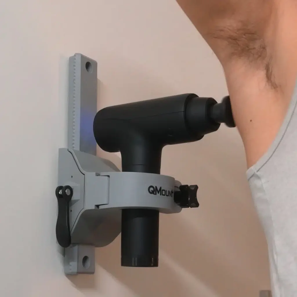 Man using Qmount Massage Gun Mount on back